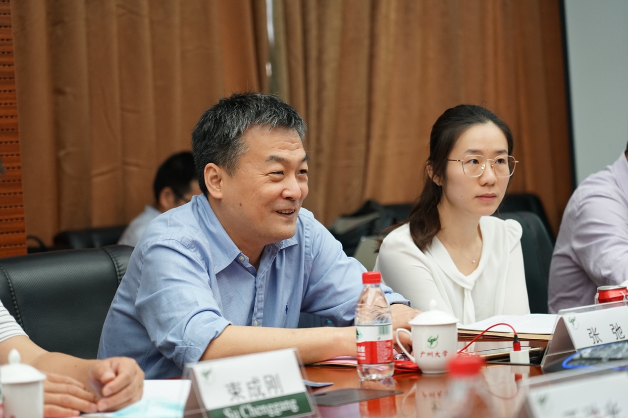 A person and person sitting at a table with papers and cupsDescription automatically generated with low confidence A person and person sitting at a table with papers and cupsDescription automatically generated with low confidence